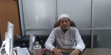 Kepala UPT Pembelajaran di Luar Kampus (UPT Pelpus), Syofyan saat ditemui di UPT Pelpus Gedung PKM lt.1 Universitas Andalas pada Jumat (19/8/2022). (Genta Andalas/Souty Syahrani)